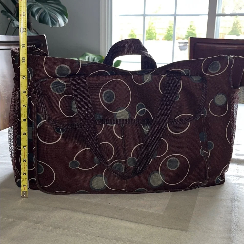 All purpose Brown Polka Dot Vinyl Tote Bag Open at top with side pockets.